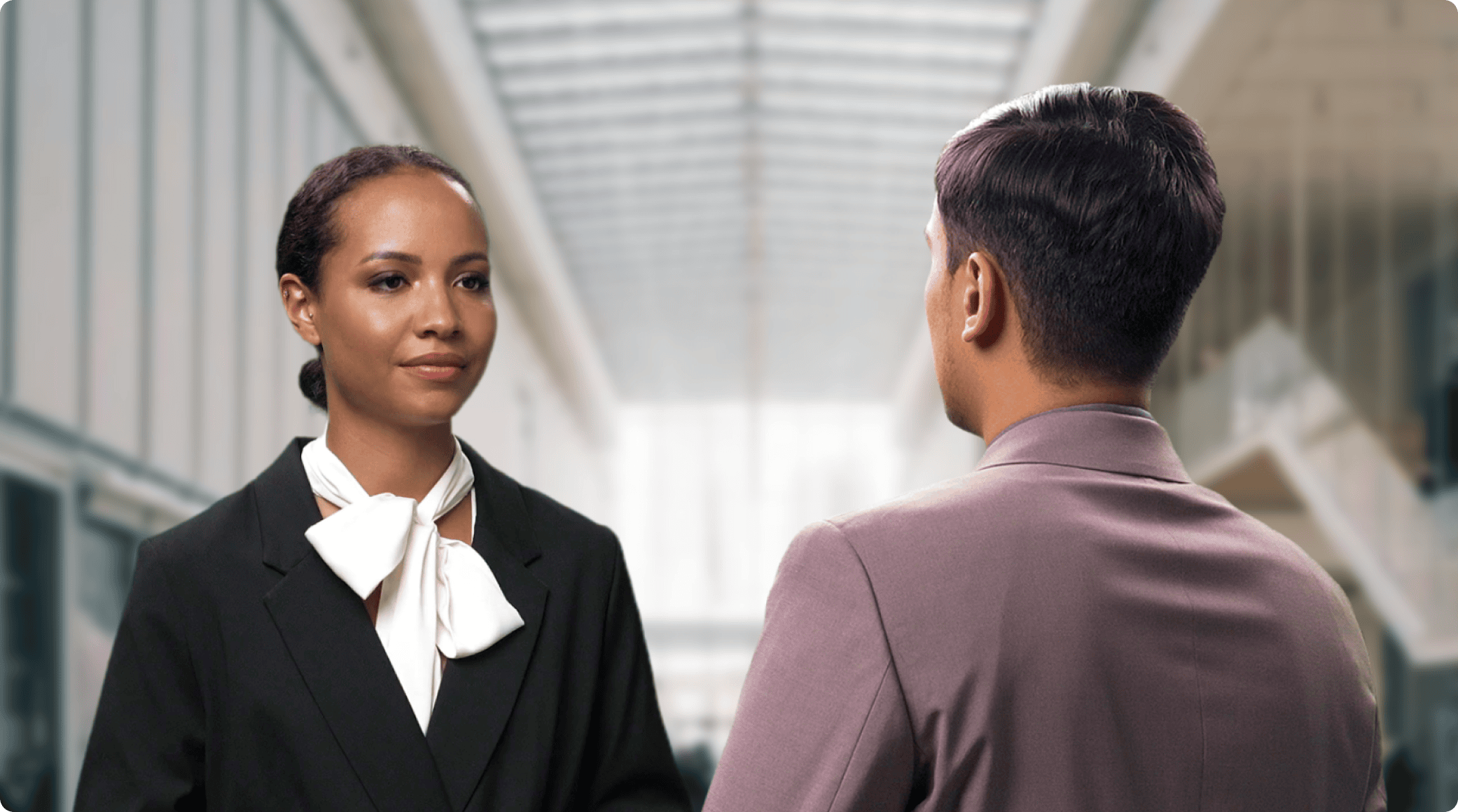 Two Colossyan Creator AI avatars having a conversation